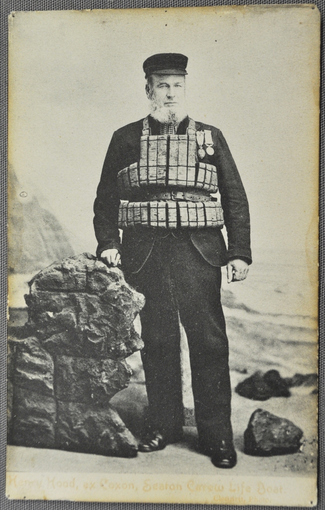 Henry Hood, wearing a cork life-jacket and the Silver RNLI and Albert medals -awarded  for his bravery whilst saving the crew of the Atlas. 