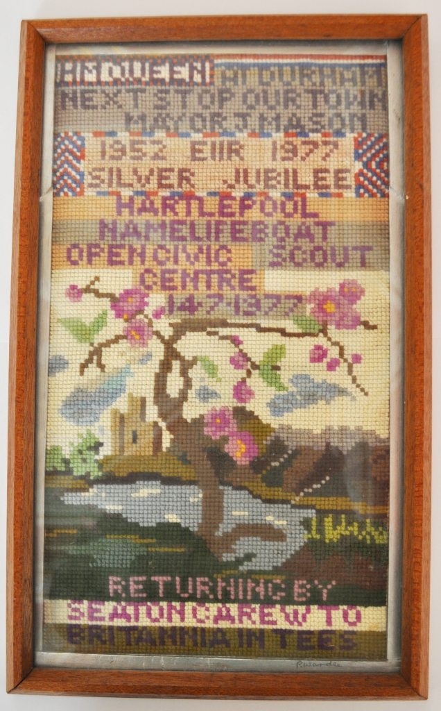 A tapestry made by Mr. P. Wardle of Seaton Carew, commemorating the visit of the Queen to Hartlepool on the 14th of July 1977, when she opened the Civic Centre and named the Lifeboat 